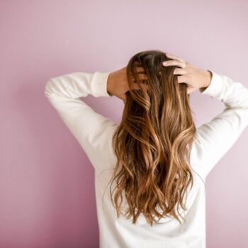 woman wearing white long sleeved shirt